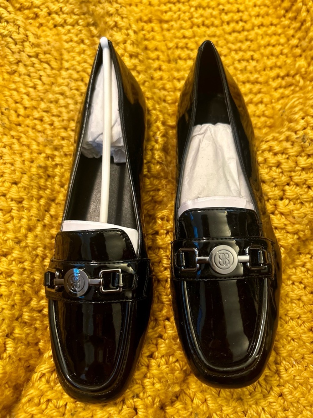 NWOT Bandolino Black Patent Loafers with Silver-Tone Emblem; size 7.5